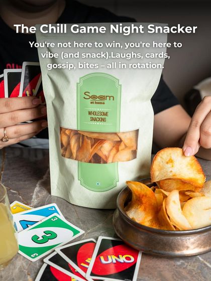 "The Chill Game Night Snacker" enjoys a bowl of my chips while playing Uno. It shows my snacks are perfect for fun, social moments.