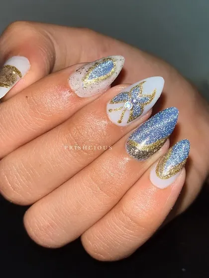 A close-up of the glittery butterfly nail art. The details are all created with different shades of glitter polish for maximum sparkle.