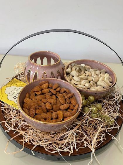 This beautifully arranged Diwali gift basket combines my handmade ceramics with festive treats, making it a complete and thoughtful present.