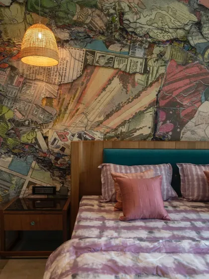 A detailed shot of the vibrant mural behind the bed, showcasing the intricate, layered comic art that gives this bedroom its unique personality.