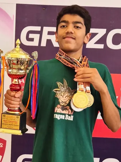 Aarez Asif with his impressive collection of medals and the championship trophy. Each one represents a story of dedication.