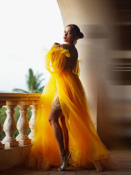 A portrait of Manisha looking back, with the soft outdoor light creating a dreamy and romantic atmosphere. This is perfect for an editorial fashion story.