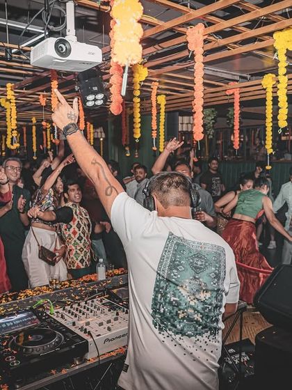 The energy of a Sangeet night is unbeatable. Here I am, commanding the dance floor from the console, ensuring the music flows perfectly as family and friends perform and celebrate.