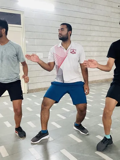 Footwork is the foundation of fencing. Our senior fencers practice their 'en garde' stance and movement, ensuring perfect balance and readiness for both epee and sabre.