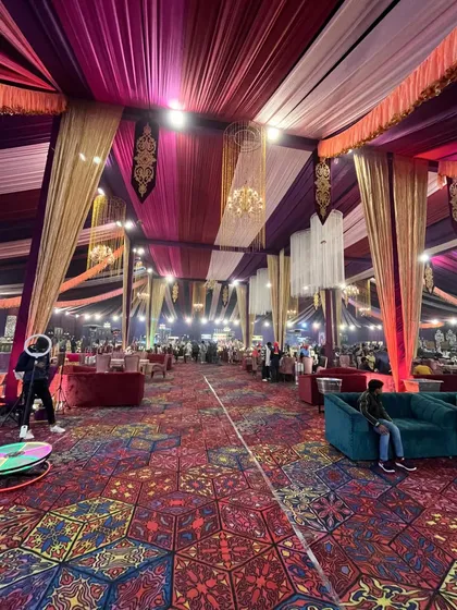A wide, dynamic shot of the entire event hall, filled with guests, showcasing the vibrant and lively atmosphere we create.