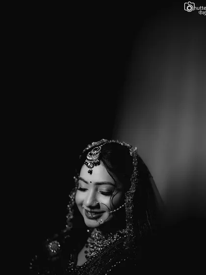 A timeless black and white bridal portrait. This classic style emphasizes emotion and expression, creating a truly elegant and enduring image.