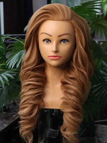 A voluminous wedding hairstyle, perfect for an engagement or reception. The deep, textured curls create a full and glamorous look that is sure to impress.