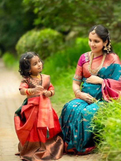 An adorable interaction between mother and daughter, capturing a candid moment of conversation and love.