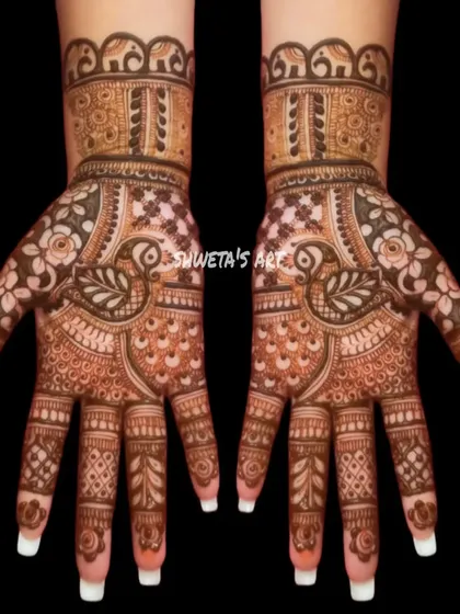 A beautiful and balanced design for the hands. This pattern features peacocks and elephants, making it a great choice for a traditional look at any festival or party.