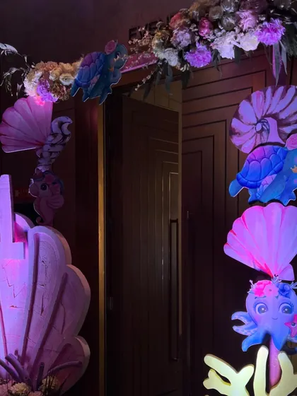 For Jivana and Janya's first birthday, we created another enchanting under-the-sea world, featuring marquee letters, iridescent backdrops, and a soft play area for the tiniest guests.