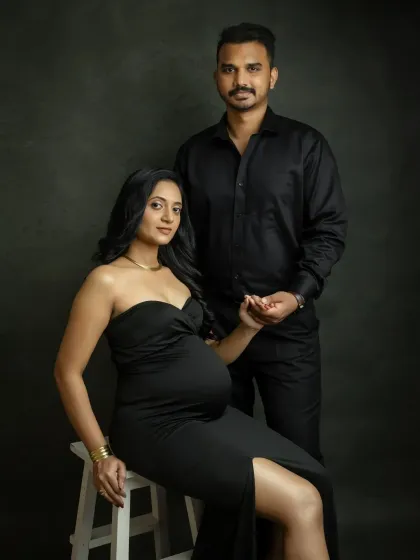 A powerful and chic studio portrait. Dressed in matching black, you both exude confidence and style. This is a modern and sophisticated way to capture your maternity journey.
