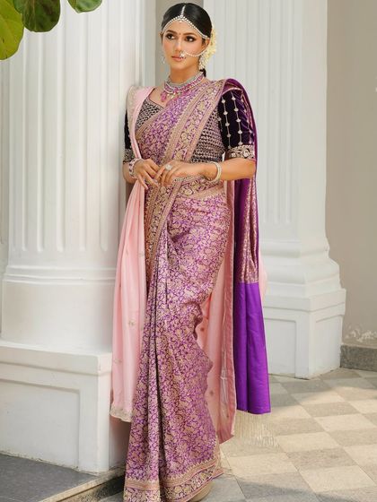 A full-length view of the elegant silk saree look. The makeup is kept soft and radiant, allowing the rich colors and textures of the saree to take center stage.