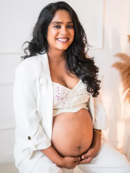 The radiant glow of a mother-to-be. I love capturing the quiet strength and beauty of pregnancy. This portrait, with its clean, modern feel, focuses on the beautiful bond between a mother and her unborn child, a simple and powerful moment of anticipation.