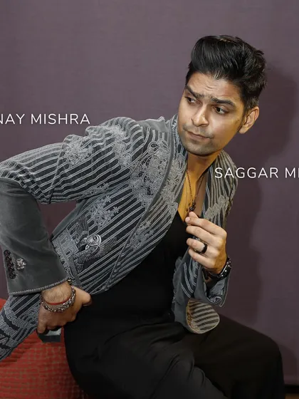 A different angle of Vinay Mishra, highlighting the striped pattern within the embroidery. The design is inspired by architectural lines and traditional motifs, fused into a modern statement.
