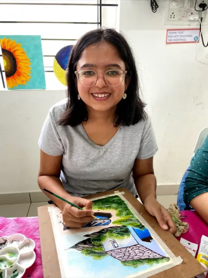 A student in our acrylics course painting a beautiful beach scene. The 8-week program allows you to master techniques like blending and layering.