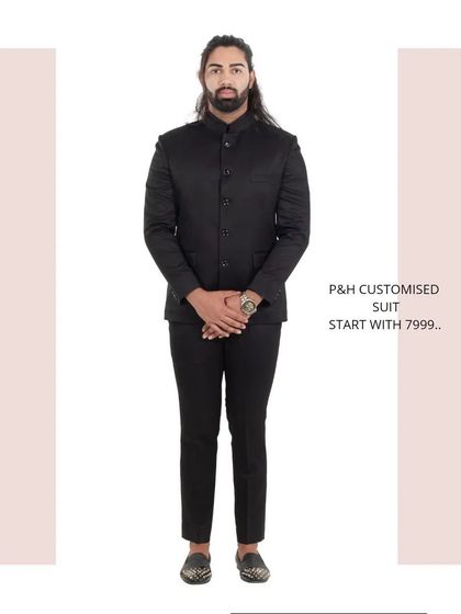 A classic black Jodhpuri or Bandhgala suit, a timeless and essential piece for formal Indian occasions.