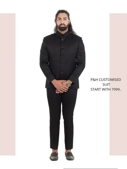 A classic black Jodhpuri or Bandhgala suit, a timeless and essential piece for formal Indian occasions.