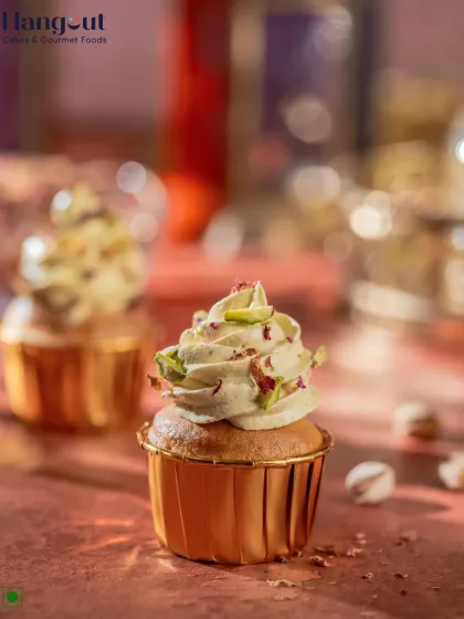 This Pistachio Rasmalai Cupcake features a silky rasmalai swirl frosting, topped with a nutty pistachio crunch and fragrant rose petals. It's a cupcake that melts in your heart.