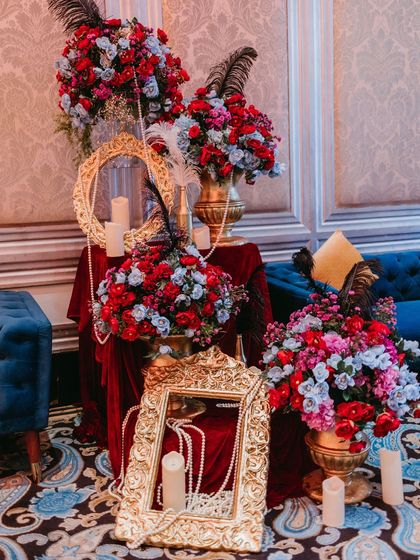 Creating luxe lounge areas is key to a great party. For this Masquerade theme, we paired rich velvet seating with dramatic floral arrangements and candlelit corners.
