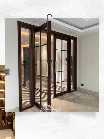 Glass panel doors, often called French doors, are excellent for connecting spaces while allowing light to flow through. This set, with its clean lines and dark wood finish, adds elegance to this home library entrance.