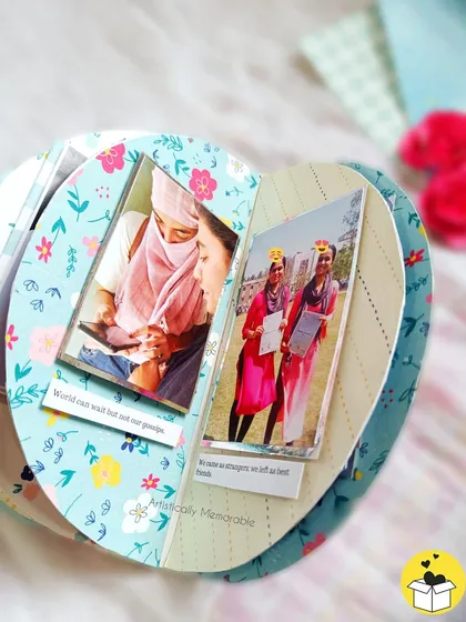 Inside the semicircle album, showing how the curved pages open up to reveal photos and notes about your friendship.