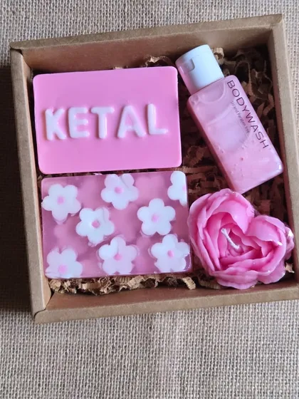A personalized floral hamper for "Ketal". This set includes a custom name soap, a floral soap, a rose-shaped candle, and a matching body wash.