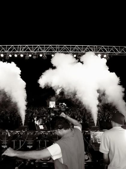 A black and white photo from the DJ console at IIM Indore, showing the scale of the production.