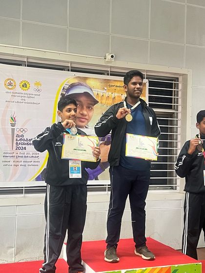 Our shooters on the podium at the Karnataka Mini Olympic games 2024, celebrating their gold and silver medal wins.