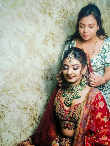 A behind-the-scenes moment, showing me adjusting the dupatta for this bridal look.