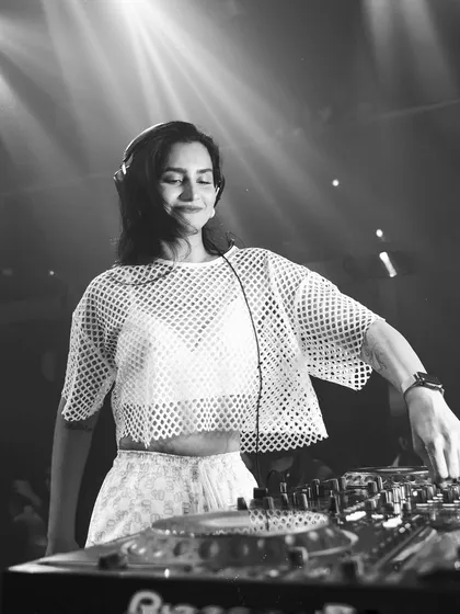 A simple, focused black and white portrait of me at the DJ console. It captures the calm before the storm.