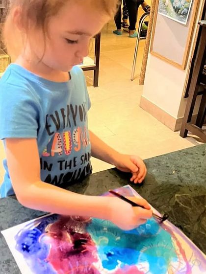 Watercolor fun with our toddlers. This little artist is exploring how colors blend and mix on the paper.