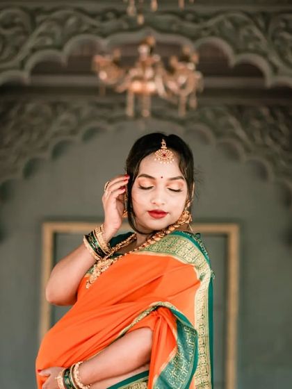 An elegant solo portrait of the mother-to-be during her traditional maternity shoot. Her graceful pose and the ornate background highlight the beauty of this special time.