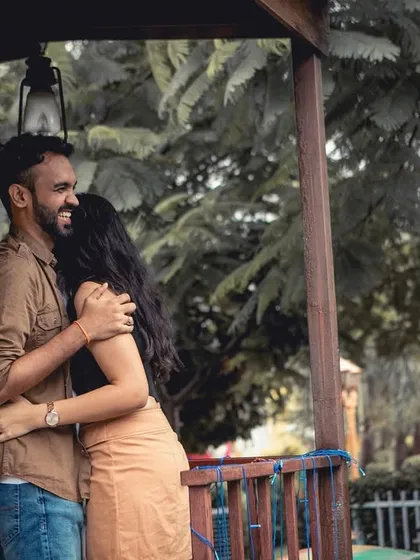 A happy and carefree hug, this pre-wedding shot captures the couple's natural joy and love for each other.