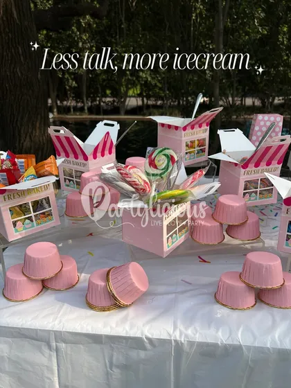 Less talk, more ice cream. A sweet treats table filled with candy and goodies, all perfectly coordinated with the ice cream party theme.