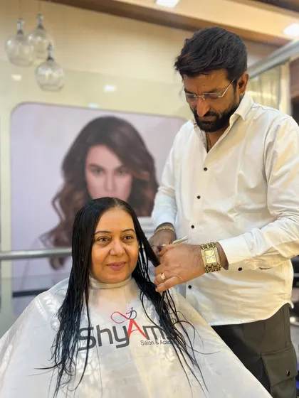 Here is our founder, Shyam Bhatia, in his element, giving a client a precision haircut. Every service starts with a solid technical foundation.