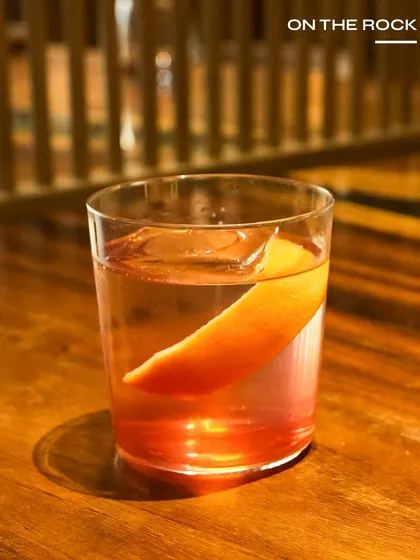 On The Rock, a simple yet powerful cocktail highlighting Ballantine’s 7 YO with a citrusy twist. It's a perfect choice for those who appreciate a quality spirit.
