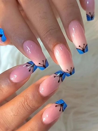Another angle of the blue floral tip nail art.
