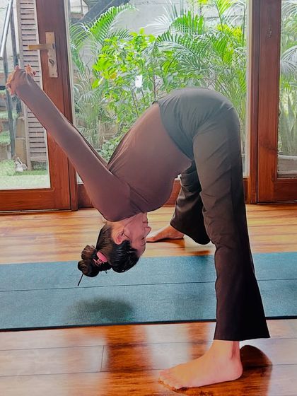 A deep forward fold, Parsvottanasana, is excellent for stretching the hamstrings and spine. A perfect way to start your morning yoga routine.