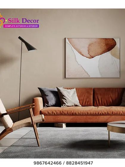 A modern living room setting featuring our custom rust-colored sofa. The clean lines and plush fabric provide a warm and inviting focal point, paired here with a woven wood accent chair to create a balanced, contemporary space.