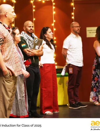 Faculty members watch proudly during the Alumni Induction ceremony for the Class of 2025.