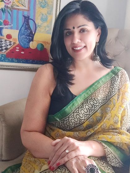 This seated pose shows how beautifully a Kota Doriya saree drapes. It's a lightweight and graceful option for any daytime event or casual outing.