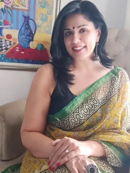 This seated pose shows how beautifully a Kota Doriya saree drapes. It's a lightweight and graceful option for any daytime event or casual outing.