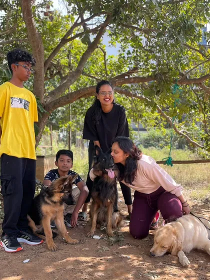 The best part of my job is seeing happy families and happy dogs. This is me with clients and their dogs Zoey, Zoe, and my Duggu after a successful group session. Building this community and seeing these bonds grow is what drives me.