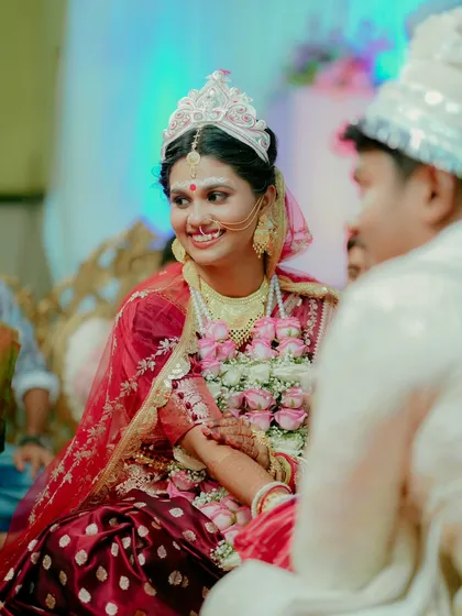 A candid, joyful smile from the bride during the ceremony. These unposed moments are the ones that truly capture the heart of the day.