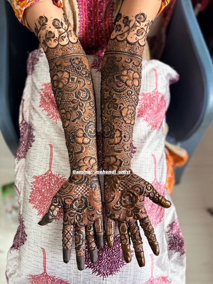 This design features a lovely mix of roses and other floral elements, creating a garden-like effect on the arms.