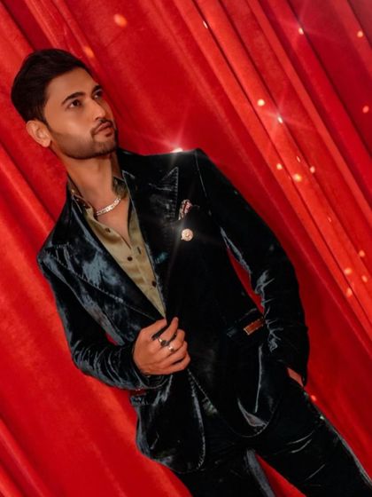 Jainam Vora in our deep green velvet tuxedo. This shot captures the luxurious sheen of the fabric and the sharp tailoring, crafted to deliver perfection.