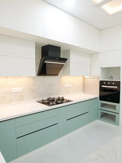 The kitchen is the engine of the home, and our modular kitchens are designed for ultimate efficiency and style. This two-tone kitchen features a sleek, handleless design, ample storage, and a layout that follows the perfect work triangle, making cooking a seamless and enjoyable experience.