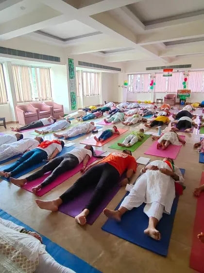 The entire group rests in Savasana during our Independence Day event. It's a moment of collective surrender and integration, allowing the benefits of the practice to settle in.