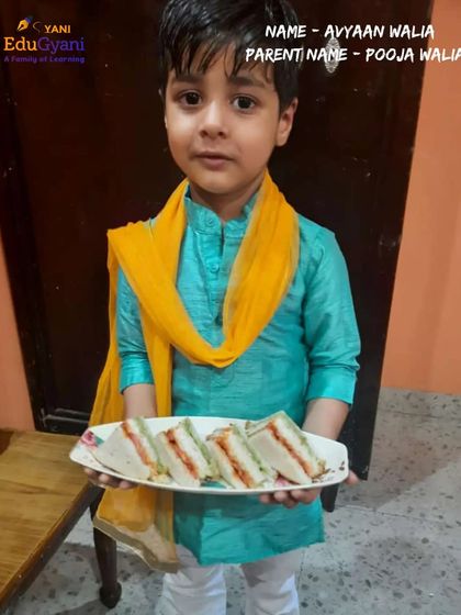 Avyaan Walia participates with a plate of tricolor sandwiches, adding a creative and delicious touch to the competition.