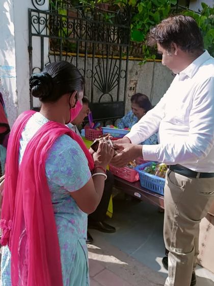 Handing out treats to people passing by. It's a wonderful way to connect with the community.